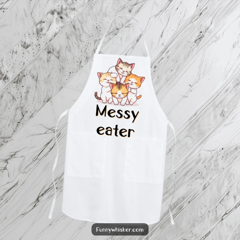 Funny apron with three cats tumbling together in a whisker tangle, perfect for kitchen enjoyment.