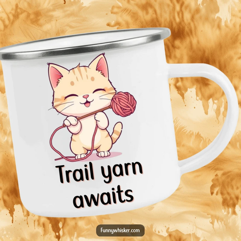 Funny Camping Mug: A cat character playfully batting at a floating, fuzzy ball of yarn in an outdoor setting.