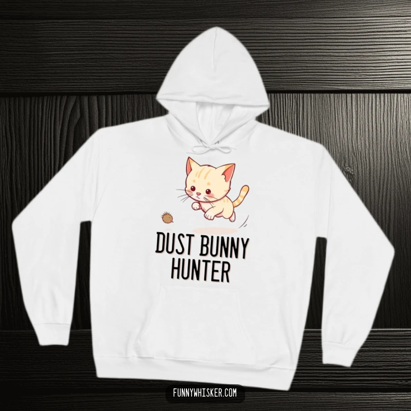 Funny cat hoodie showing a cat chasing a dust bunny with long whiskers trailing, ideal for cozy wear and pet humor.