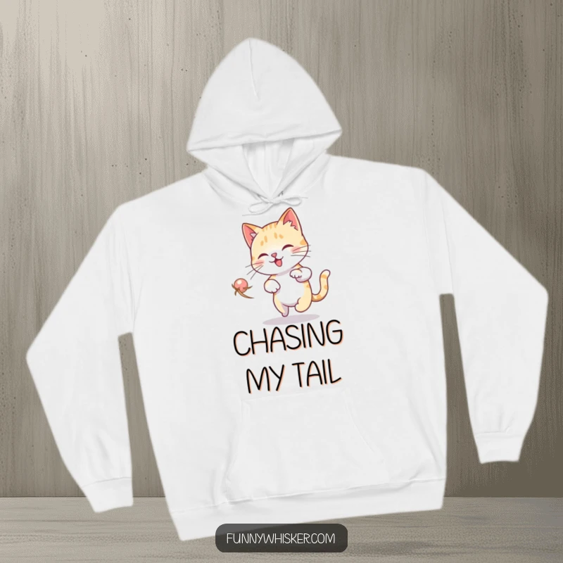 Funny Cat Dizzy Hoodie: A cat is depicted in a comical spiral, chasing its whisker with a look of delightful confusion.