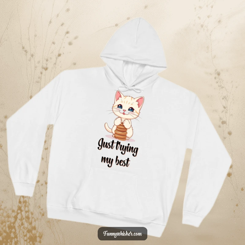 Funny hoodie featuring a cute kitten struggling to keep a stack of strings balanced, radiating playful determination and cuteness.