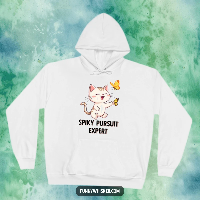 Funny hoodie showing a spiky-whiskered cat leaping with comedic intensity to catch a butterfly, embodying playful, energetic humor.