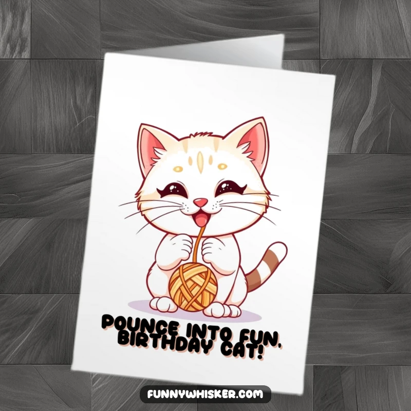 Funny free printable birthday card: A playful kitten with massive whiskers joyfully bops a dangling yarn ball.