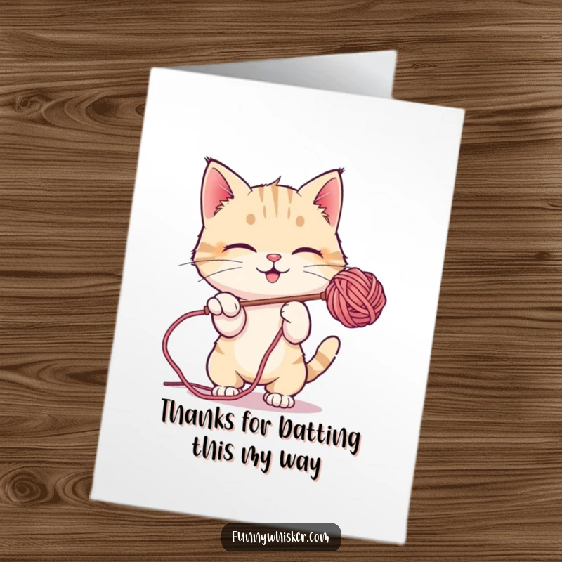 Funny Free Printable Thank You Card: A cute cat character is completely engrossed in playfully batting at a fuzzy, suspended ball of yarn.