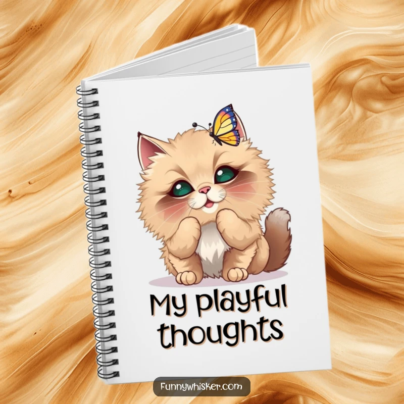Funny Notebook with a fluffy cat with oversized whiskers playfully batting at a dancing butterfly, for notes.