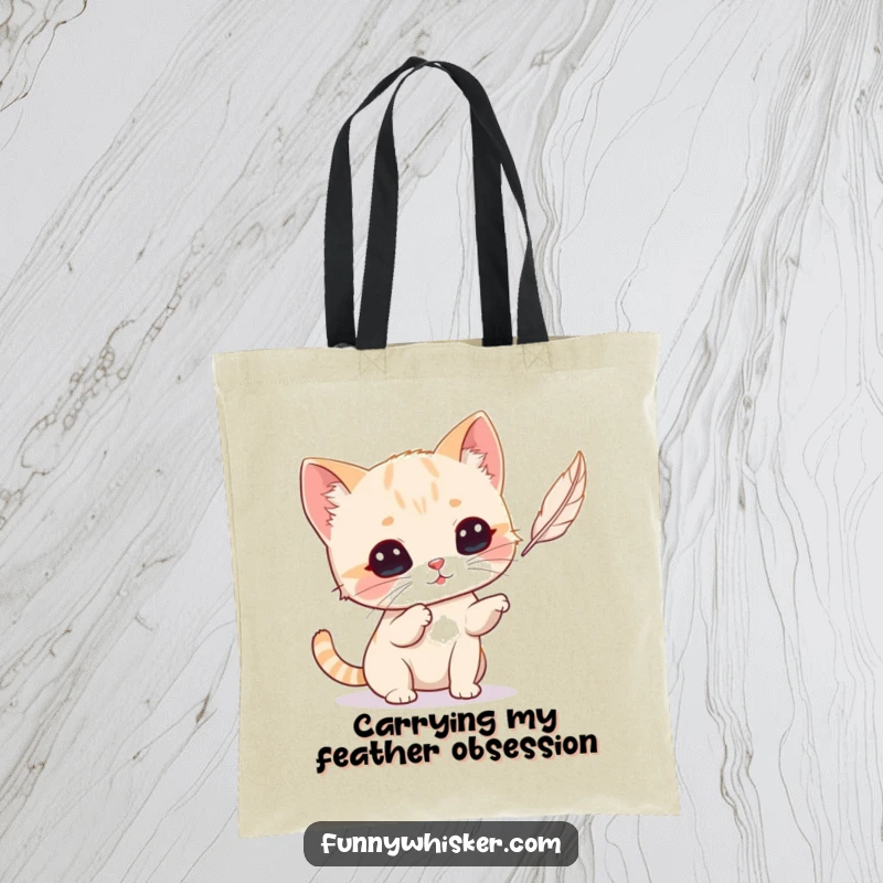 Funny Cat Tote Bag: A tiny cat with prominent whiskers playfully batting at a feather, a humorous accessory.