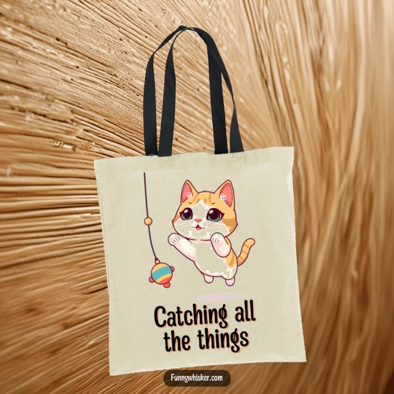 Funny Cat Tote Bag: A cat with prominent, twitching whiskers leaps dynamically for a hanging toy, a humorous accessory.